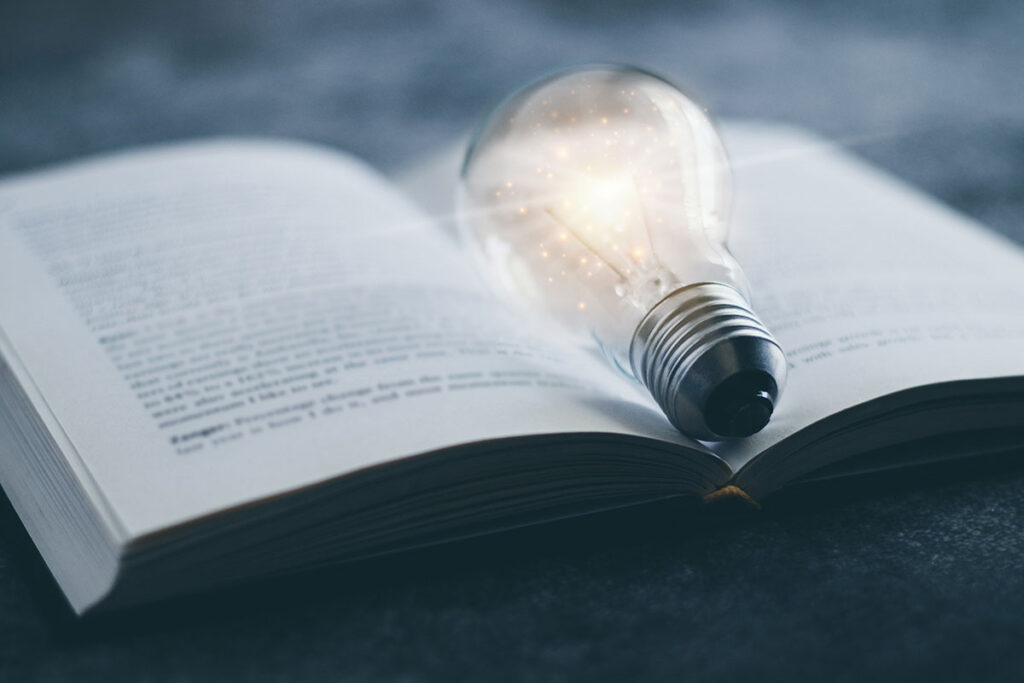 lightbulb on open book
